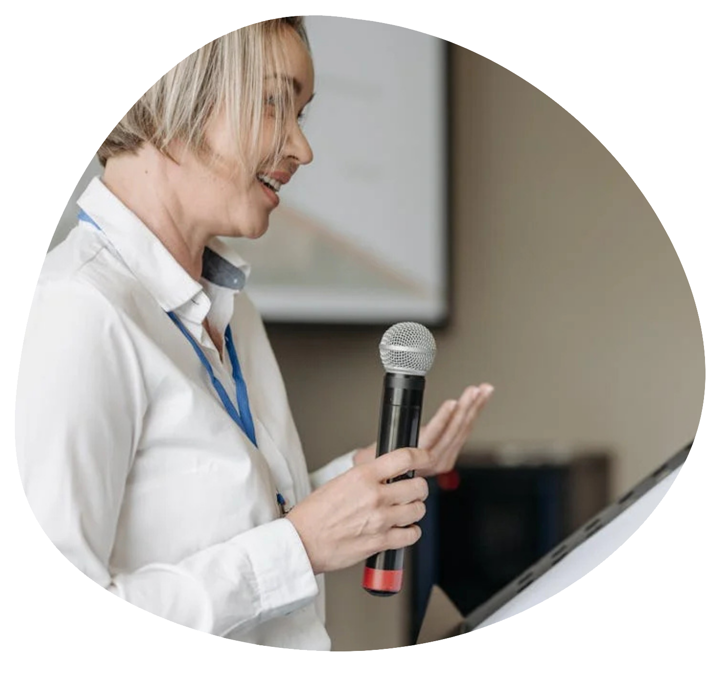 woman public speaking in a corporate context